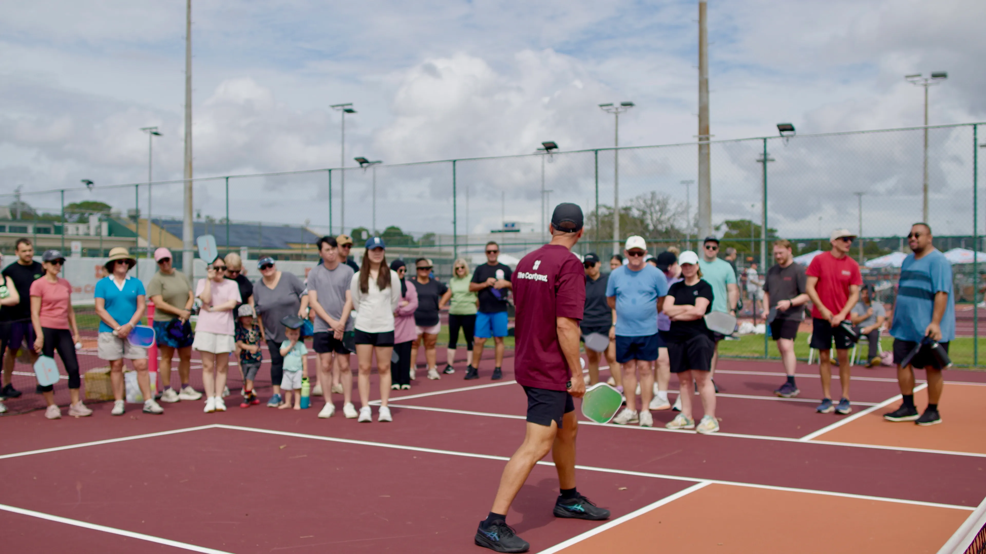 Corporate group playing pickleball at The Courtyard Newcastle